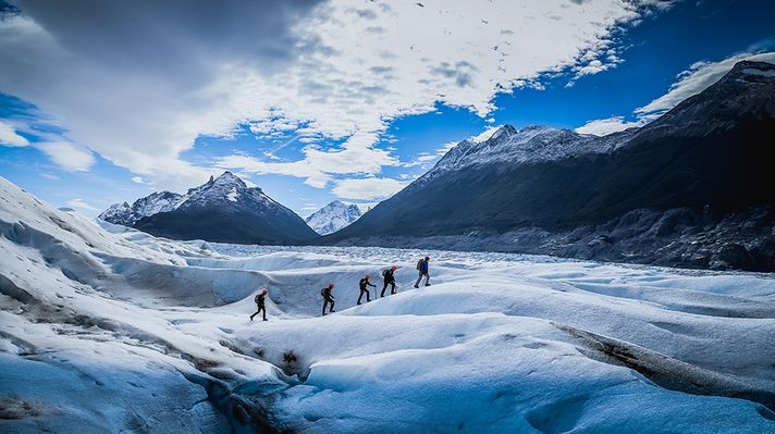 Hikers on an ice-hike trip of Glacier Grey.