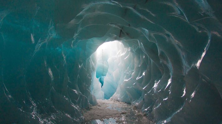 Light passing through the ice caves of M&yacute;rdalsj&ouml;kull glacier in Iceland. 