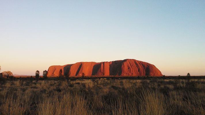 The Uluru Rock during sunset at Uluru-Kata Tjuta National Park. 
