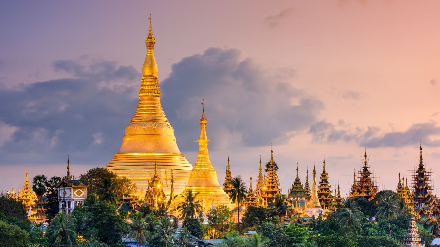A view of Shwedagon Pagoda in Myanmar at dusk.