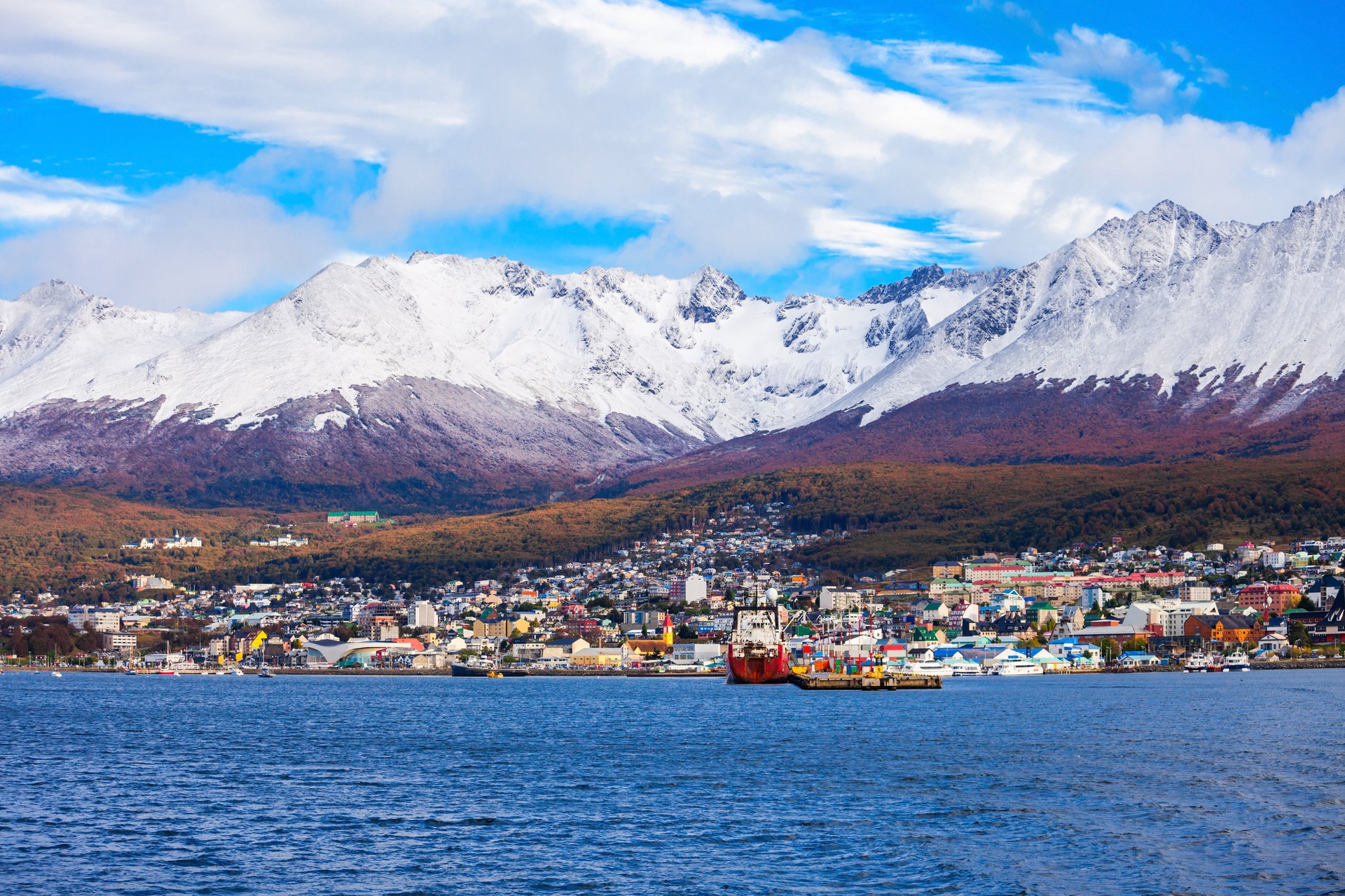 The cruise ship leaving from Ushuaia to Antarctica on a cloudy day.