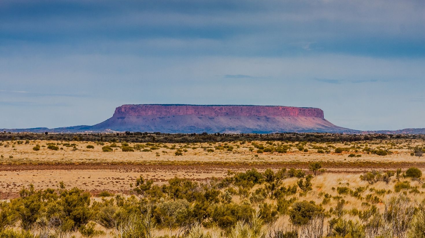 On the way from Alice Springs to Uluru, you will spot Mt Conner.