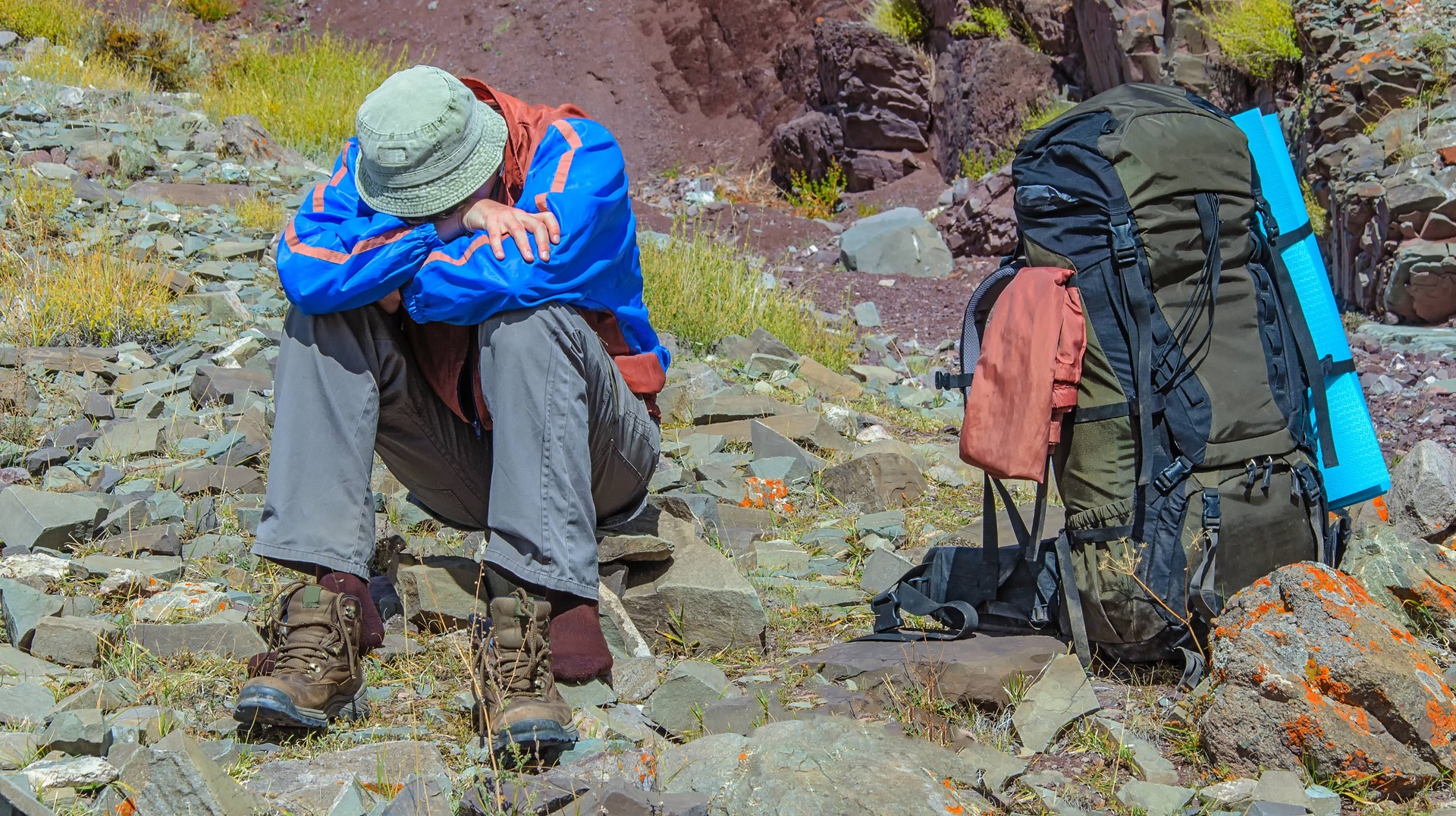 Trekker resting due to altitude illness in the Himalayan region of Nepal