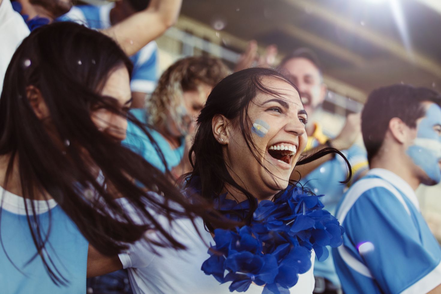 Fans supporting Argentina during a football match in the country's stadium.
