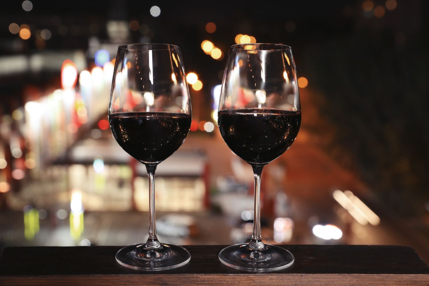 Argentine wine in the glasses on a wooden table.