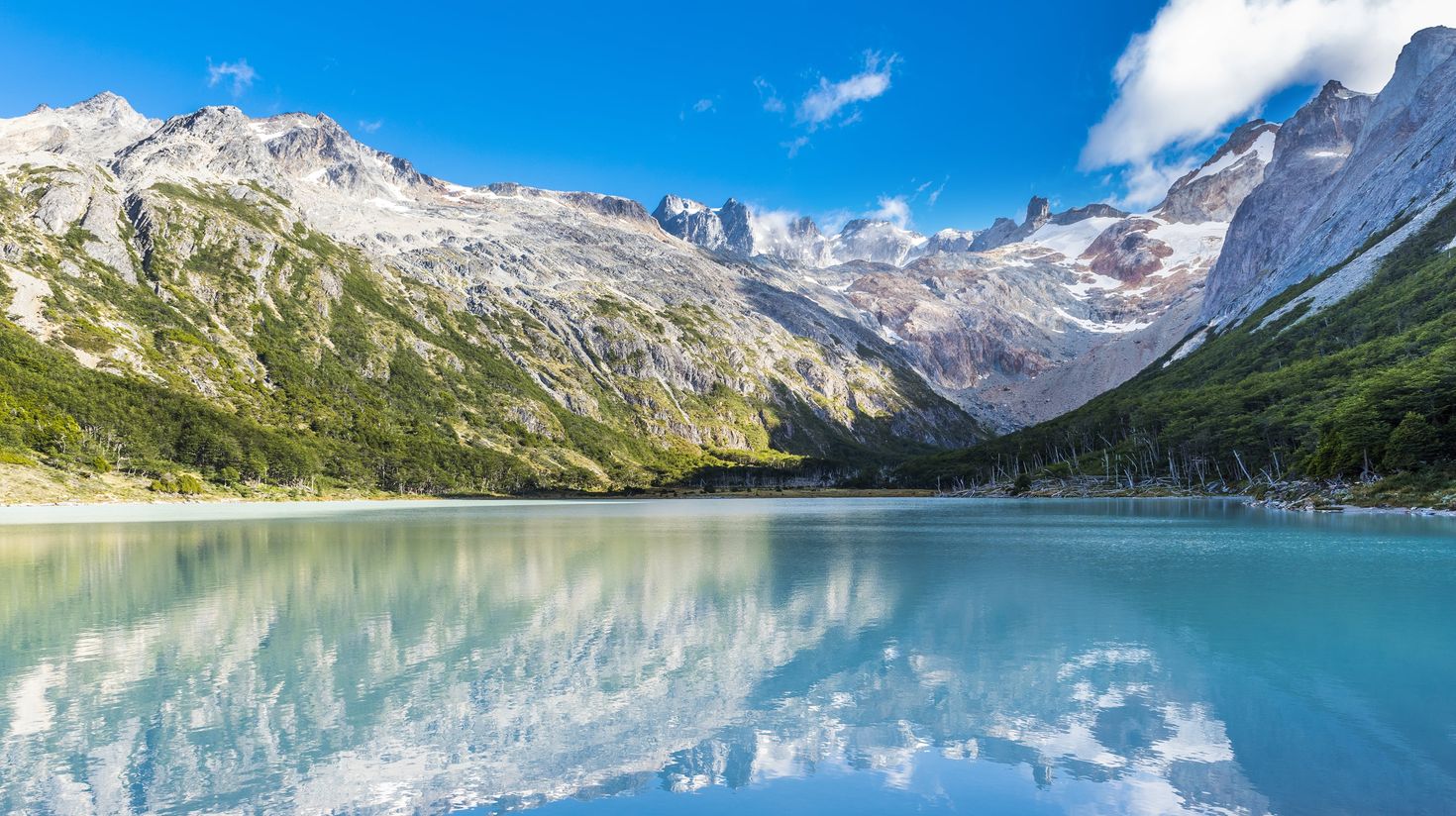 Tierra del Fuego's lake with hills in the distance on a clear day in Chile.