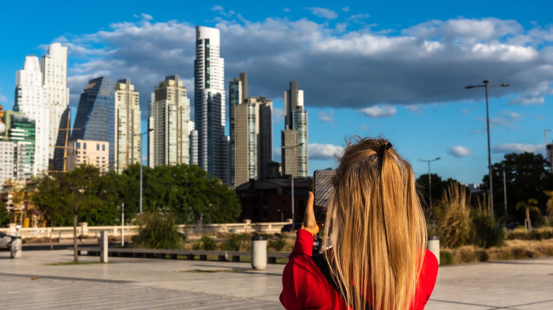 Discover the vibrant soul of Buenos Aires during your 6 days in Argentina, where history, culture, and passion converge in every corner of this iconic city. A tourist girl takes photos during her sightseeing tour in Buenos Aires on her 6 days in Argentina tour.