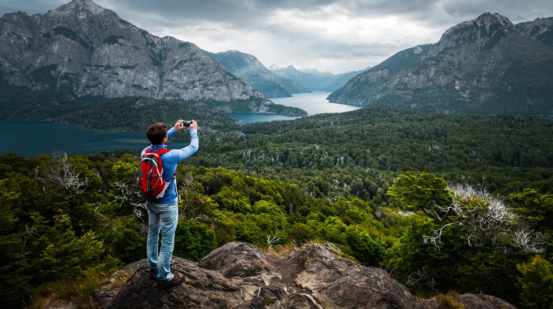 A hiker clicking photo of the landscape during during his 8 days in Argentina trip.