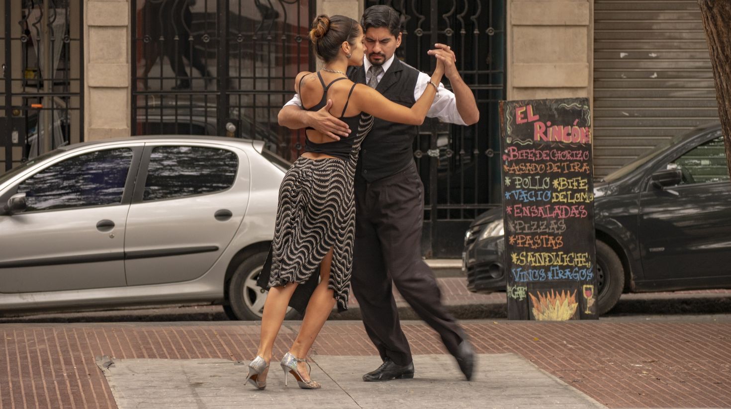 Tango dancers in the Plaza Dorredo in the historic center of San Telmo, Bue