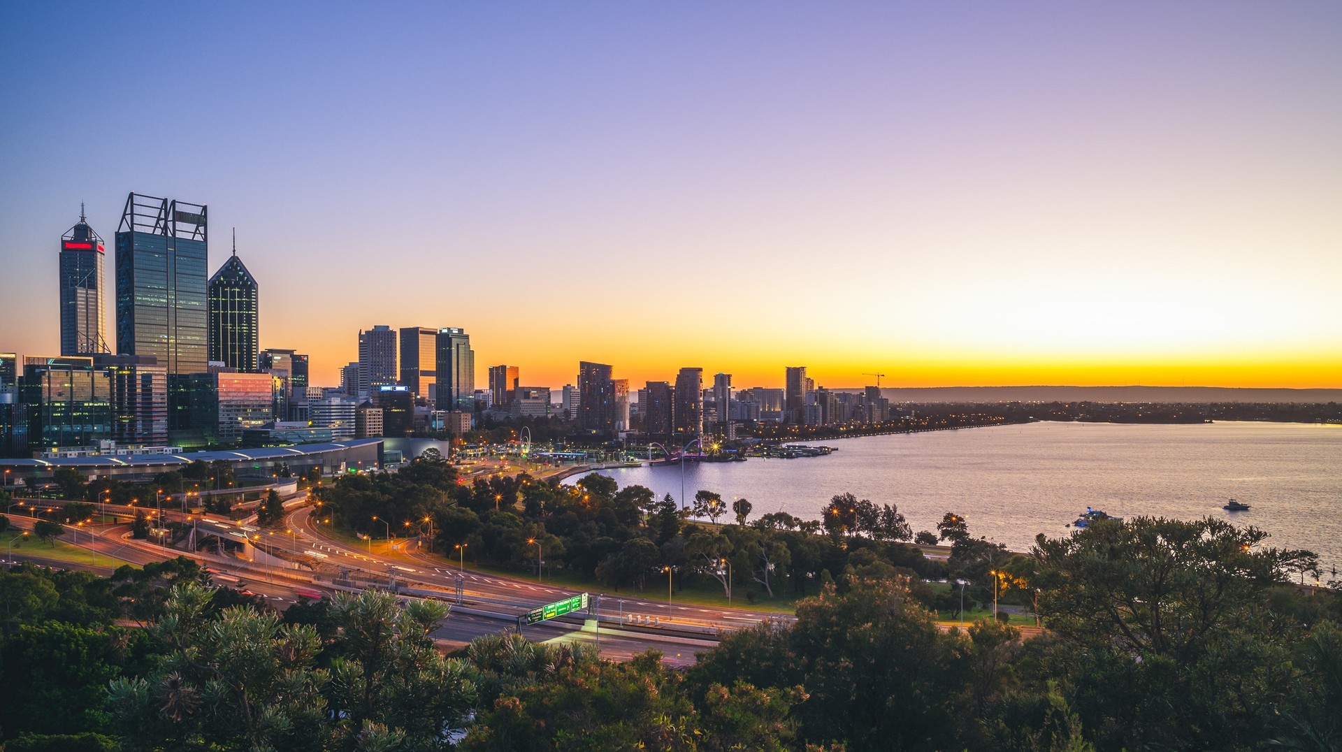 Australia is a melting pot of different global cultures and takes pride in its vibrant art scene, high-quality lifestyle, and welcoming spirit. skyline of Perth at dawn in western Australia, Australia