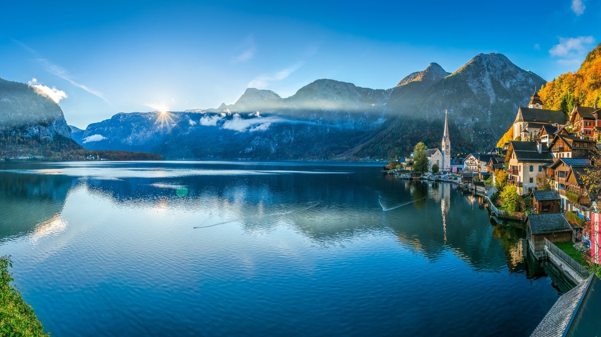 See the sunrise at Hallstatt while spending one week in Austria.