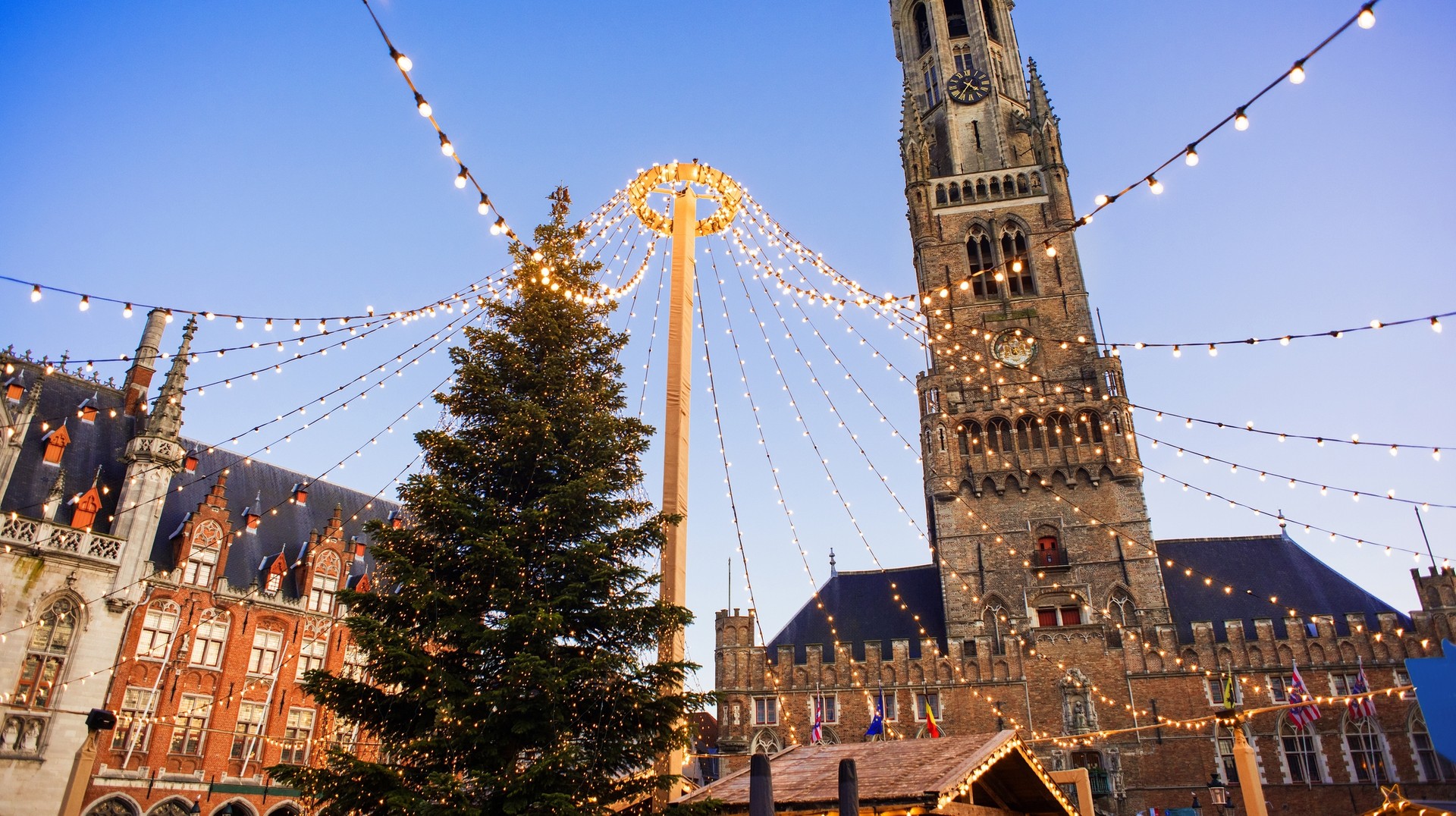 Traditional Christmas market during the evening at Bruges in Belgium in December.