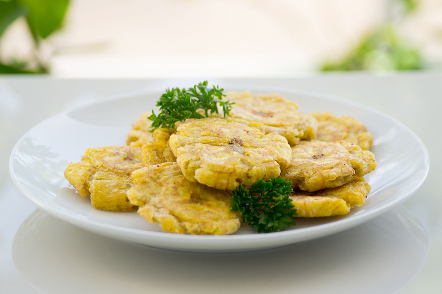 Patacones are a crispy snack that can be eaten on its own.