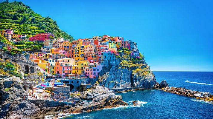 Cinque Terre in Italy with beautiful houses overlooking the sea on a clear day. 