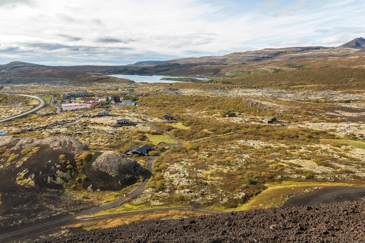 A wide view of the Grabrok volcano crater during the day in Iceland. 