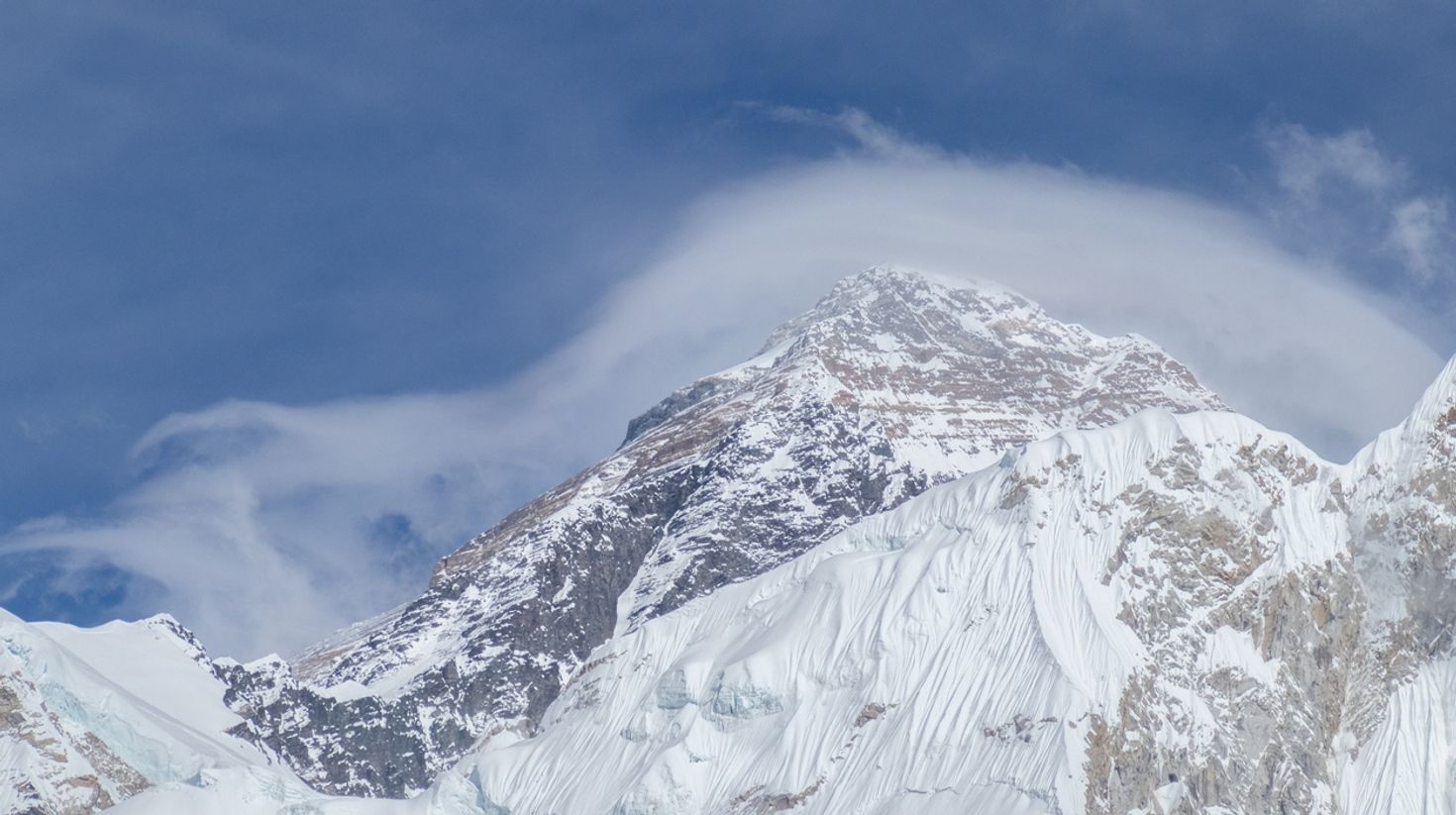 Mountains a covered in snow during your winter trek to Everest Base Camp.
