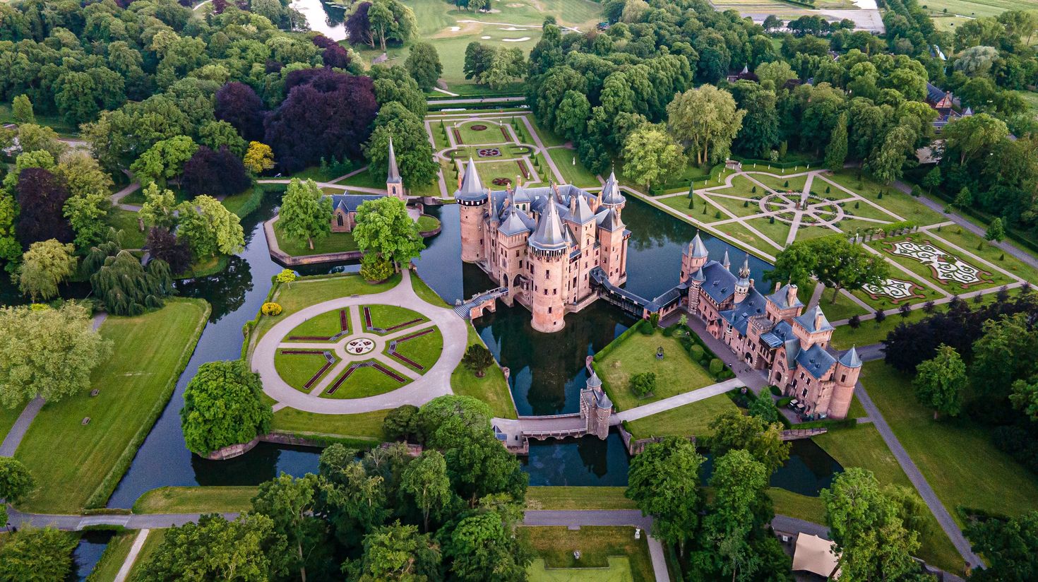 A view of Castle De Haar with garden and ponds in Holland in August.