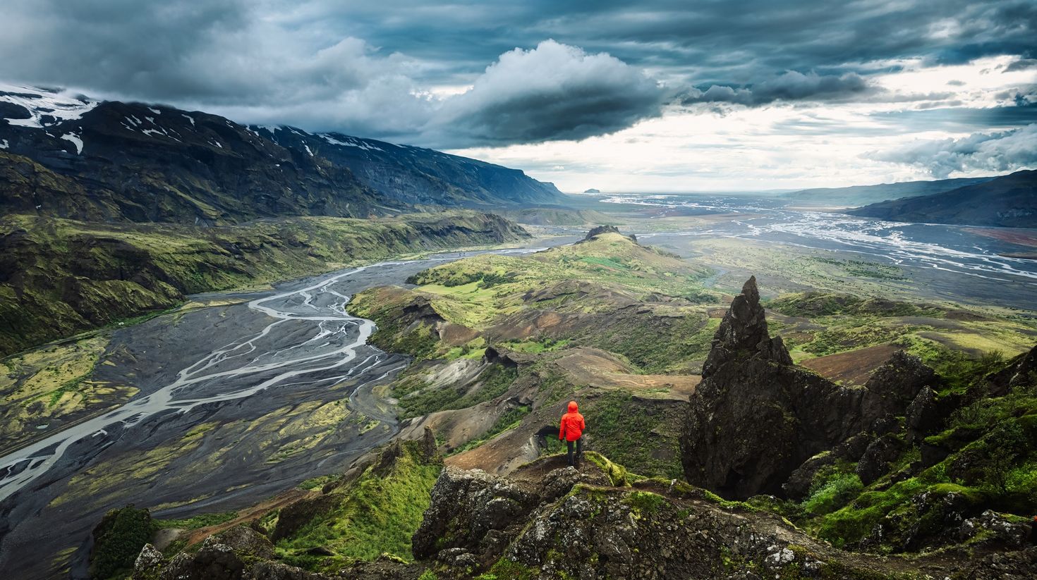 Man hiking the Icelandic highlands of Thorsmork during summer.