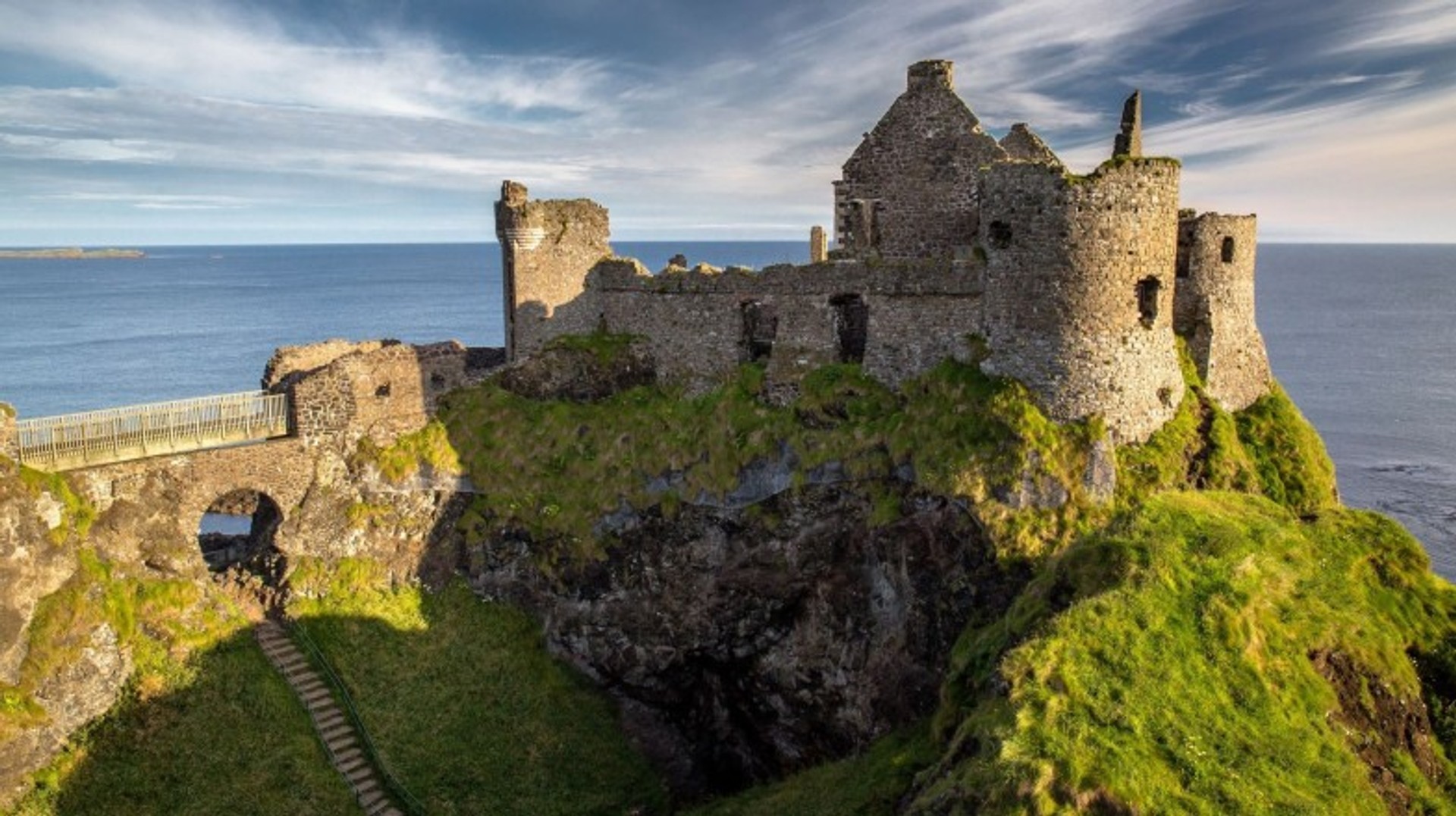 The best time to visit Ireland is from May to September, when the weather is mild, the landscapes are lush, and festivals are in full swing. Ruins of Dunluce Castle during dusk; best time to visit Ireland.