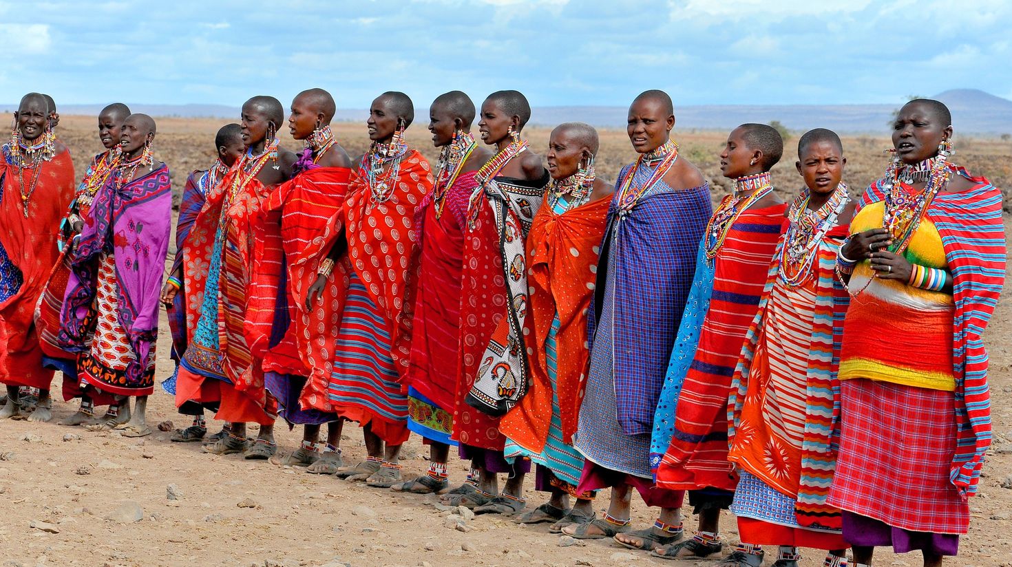 Maasai women lined up in their cultural dress.