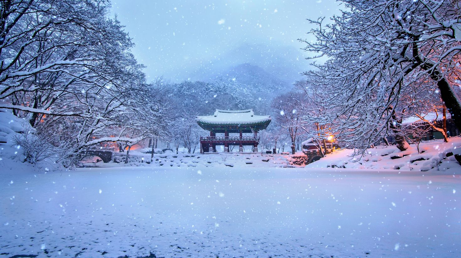 Snowfall in Baekyangsa Temple on dusk in South Korea in January.