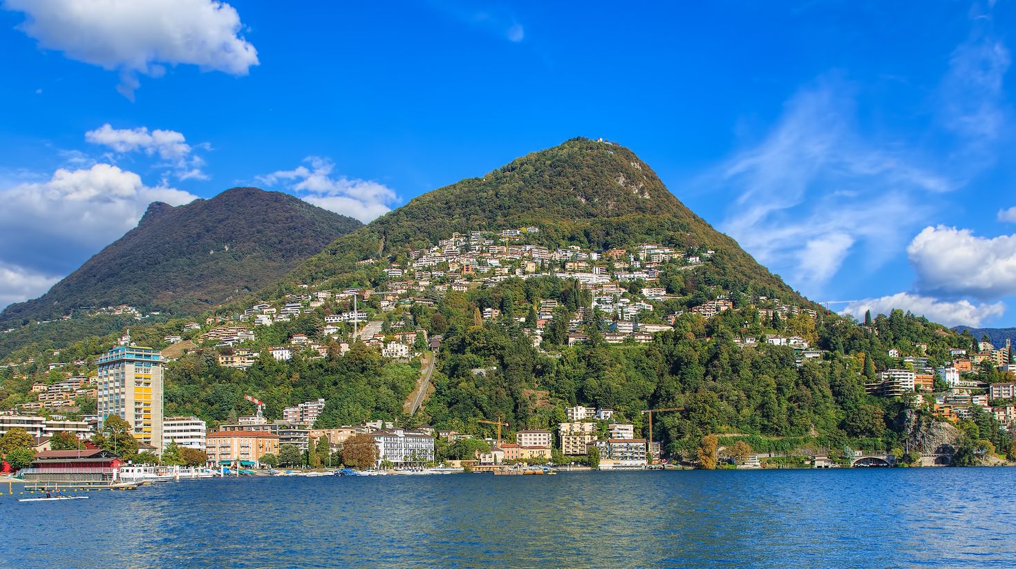 Lugano is a lakeside city in Cantone Ticino, with its beauty and gorgeous setting make it one of Switzerland's most popular holiday resorts.