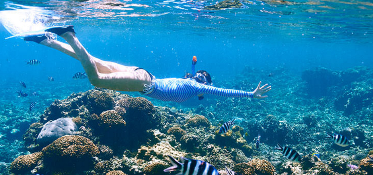 A girl enjoying the waters during the fall season.