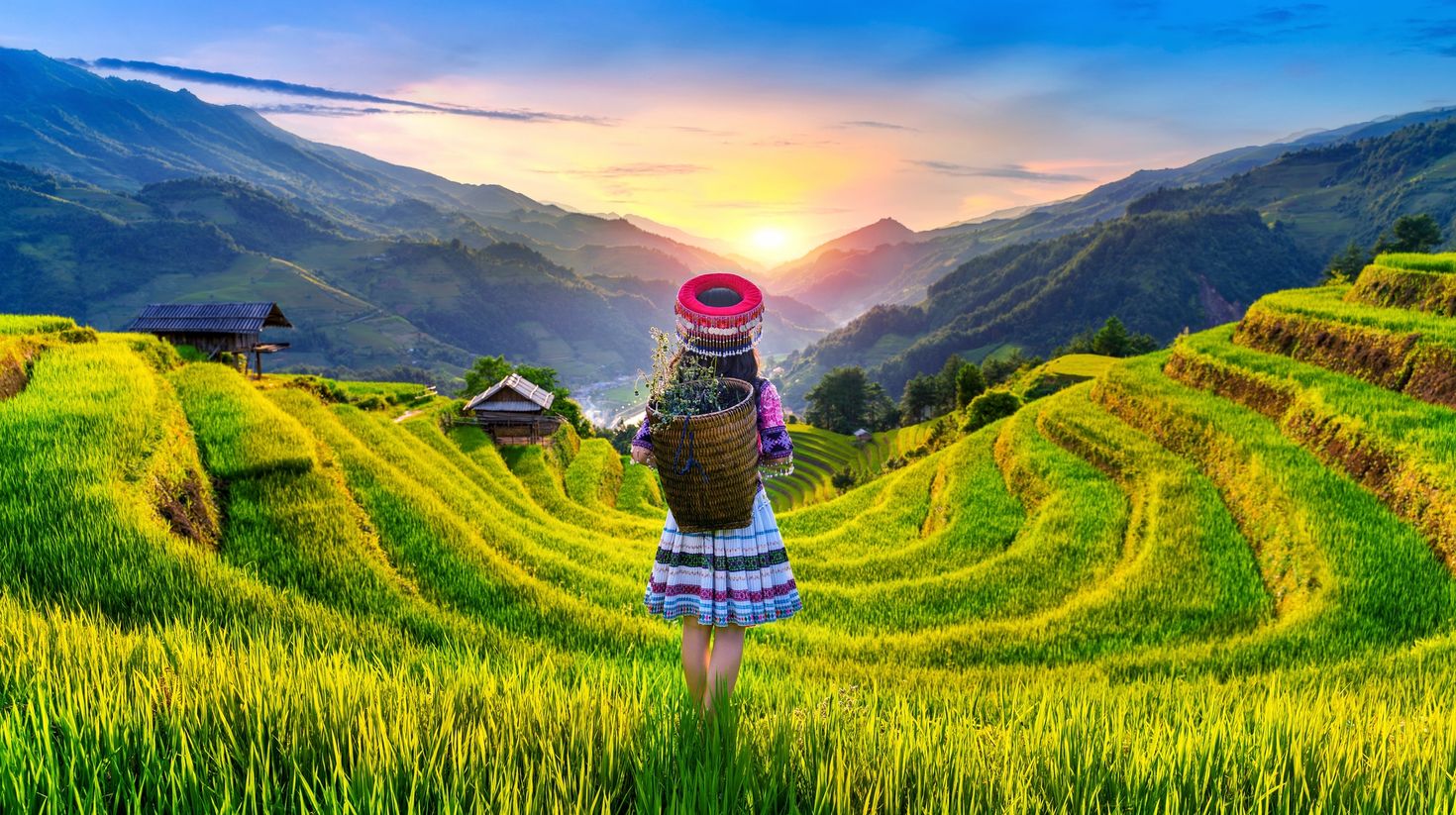 A local Hmong girl standing amidst the rice field in Mu Cang Chai.