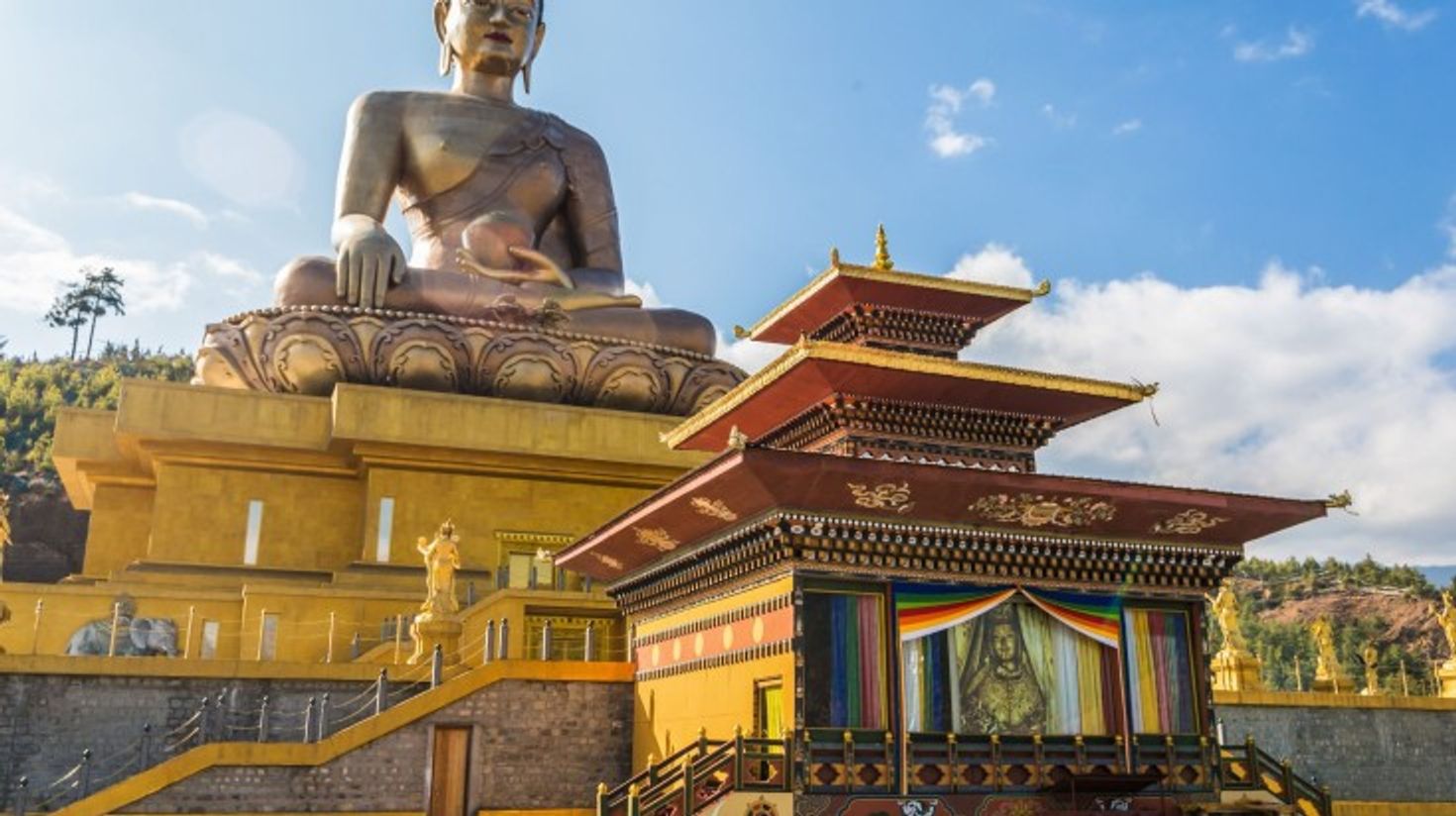 The Great Budhha Dordenma admist the ruins of Kuensel Phodrang in Thimphu.