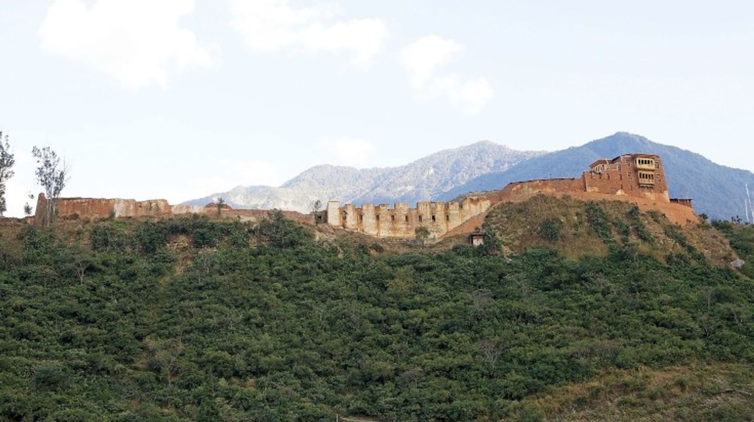 The view of Wangdue Phodrang Dzong ruins on a clear day in Bhutan.
