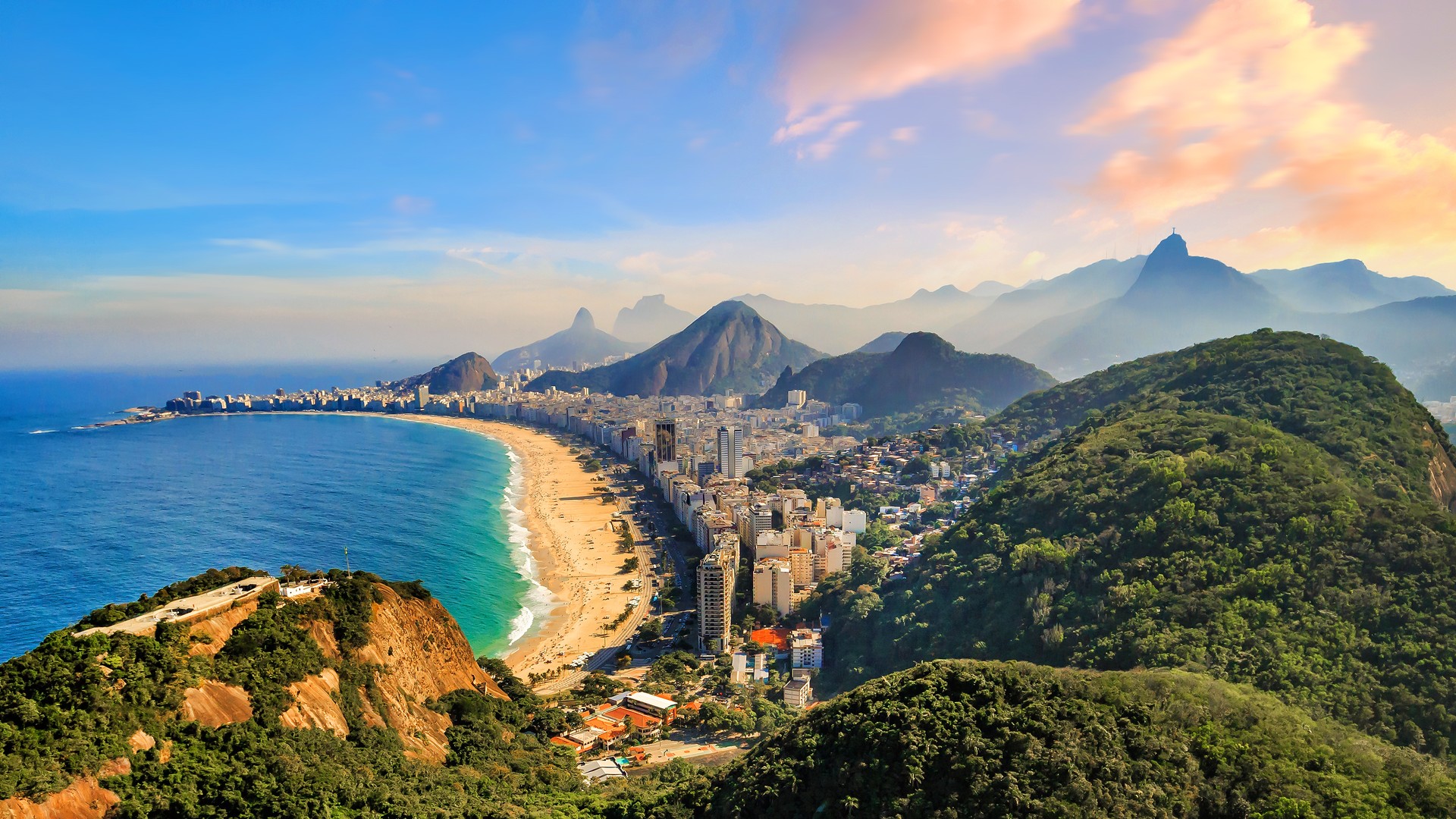 Explore the vibrant Copacabana Beach during your 10 days in Brazil, where golden sands meet the lively atmosphere, perfect for relaxation and beach sports. Panoramic view of Copacabana Beach and Ipanema Beach during dusk on your 10 days in Brazil.