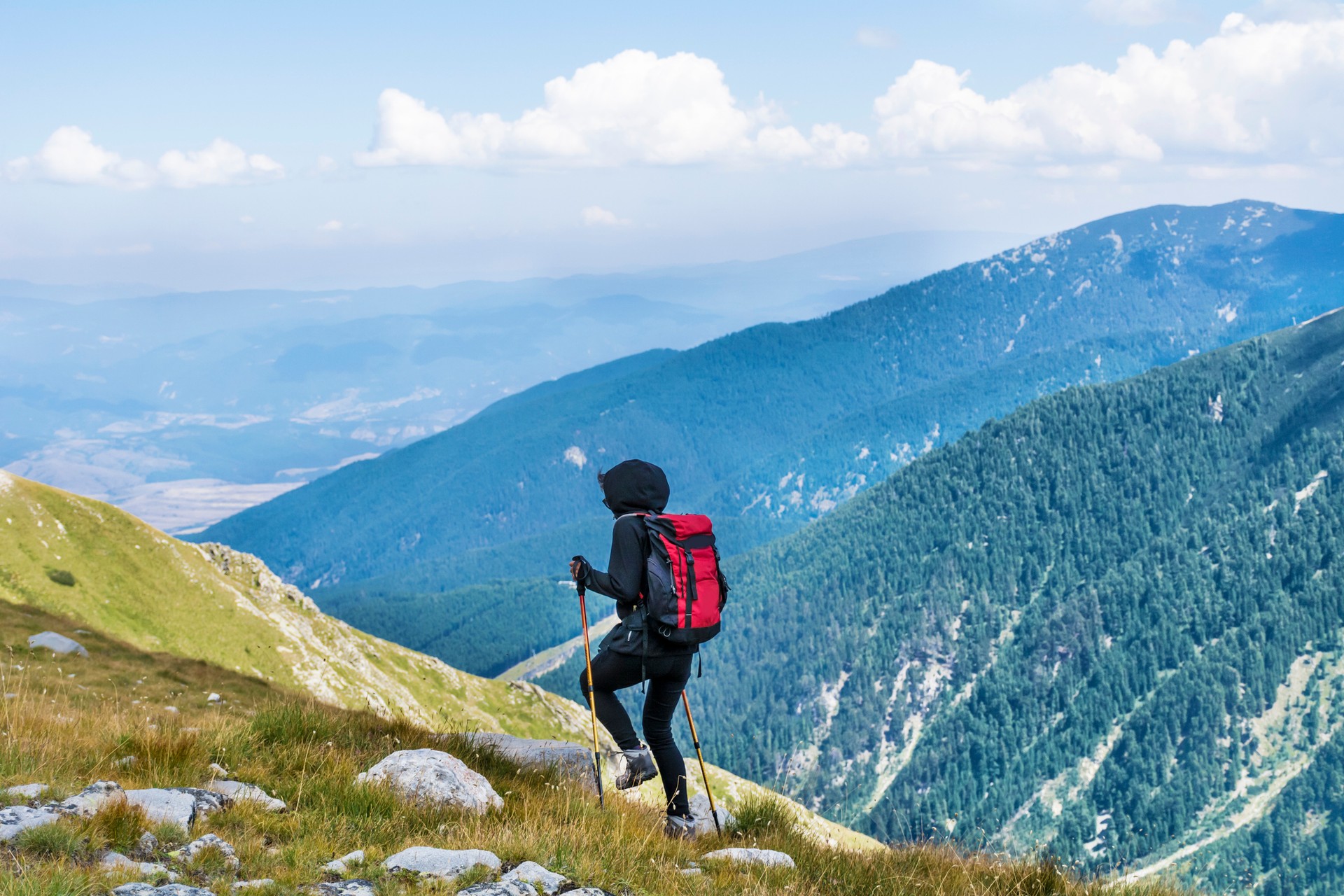 A woman hiking in Pirin mountain on a clear day during her 5 days in Bulgaria.
