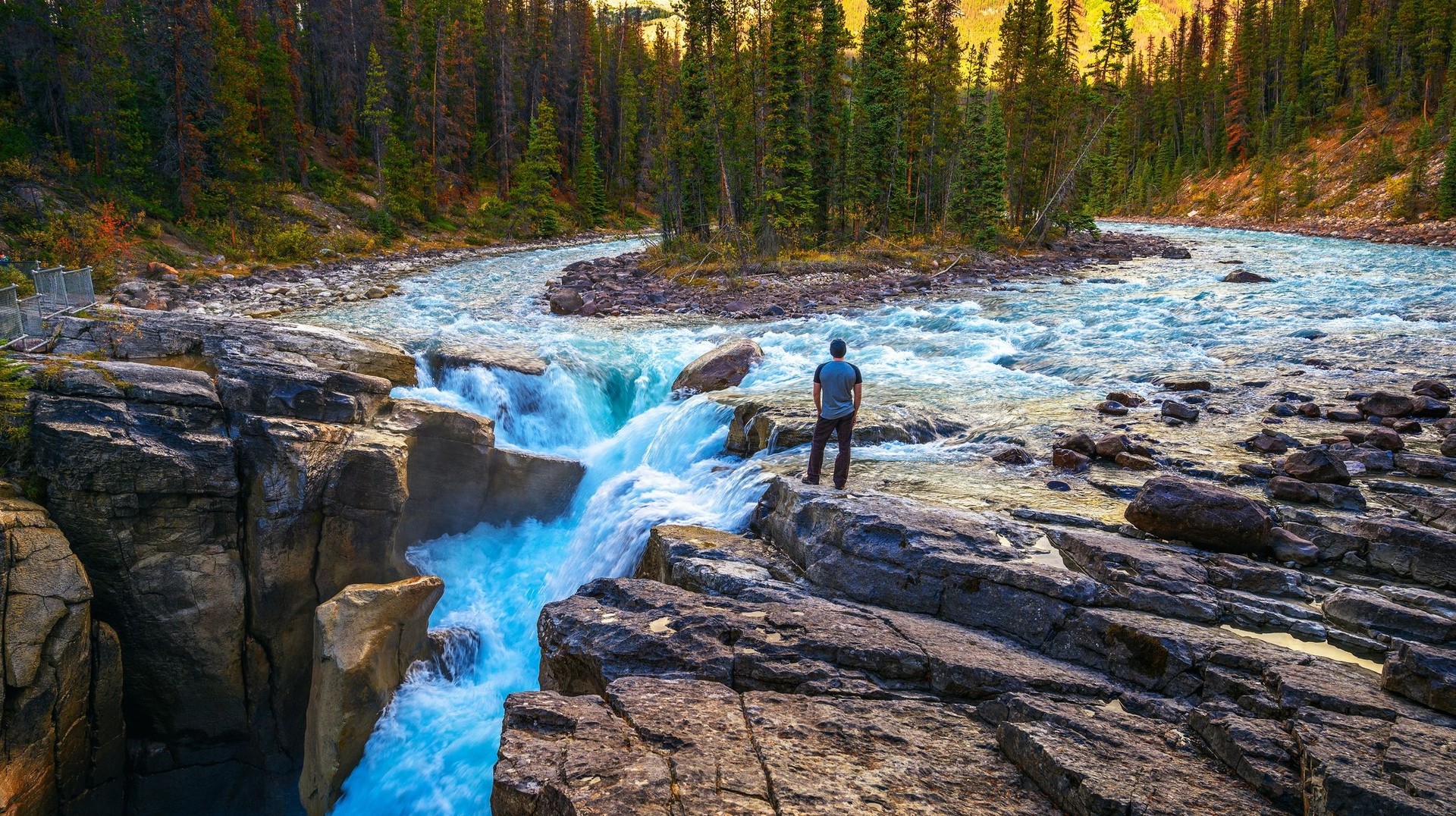 Immerse yourself in the awe-inspiring beauty of Jasper National Park during your 10 days in Canada and admire the rugged mountains, pristine lakes, and abundant wil A hiker admiring the beauty of Jasper National Park during his 10 days in Canada trip.