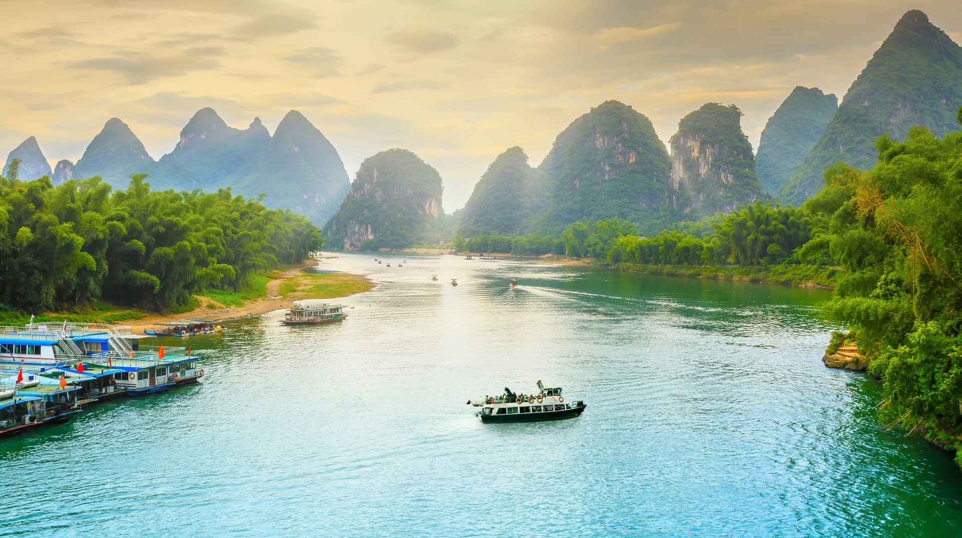 A cruise ship in Li River with Kashi Mountain in the background during 8 days in China