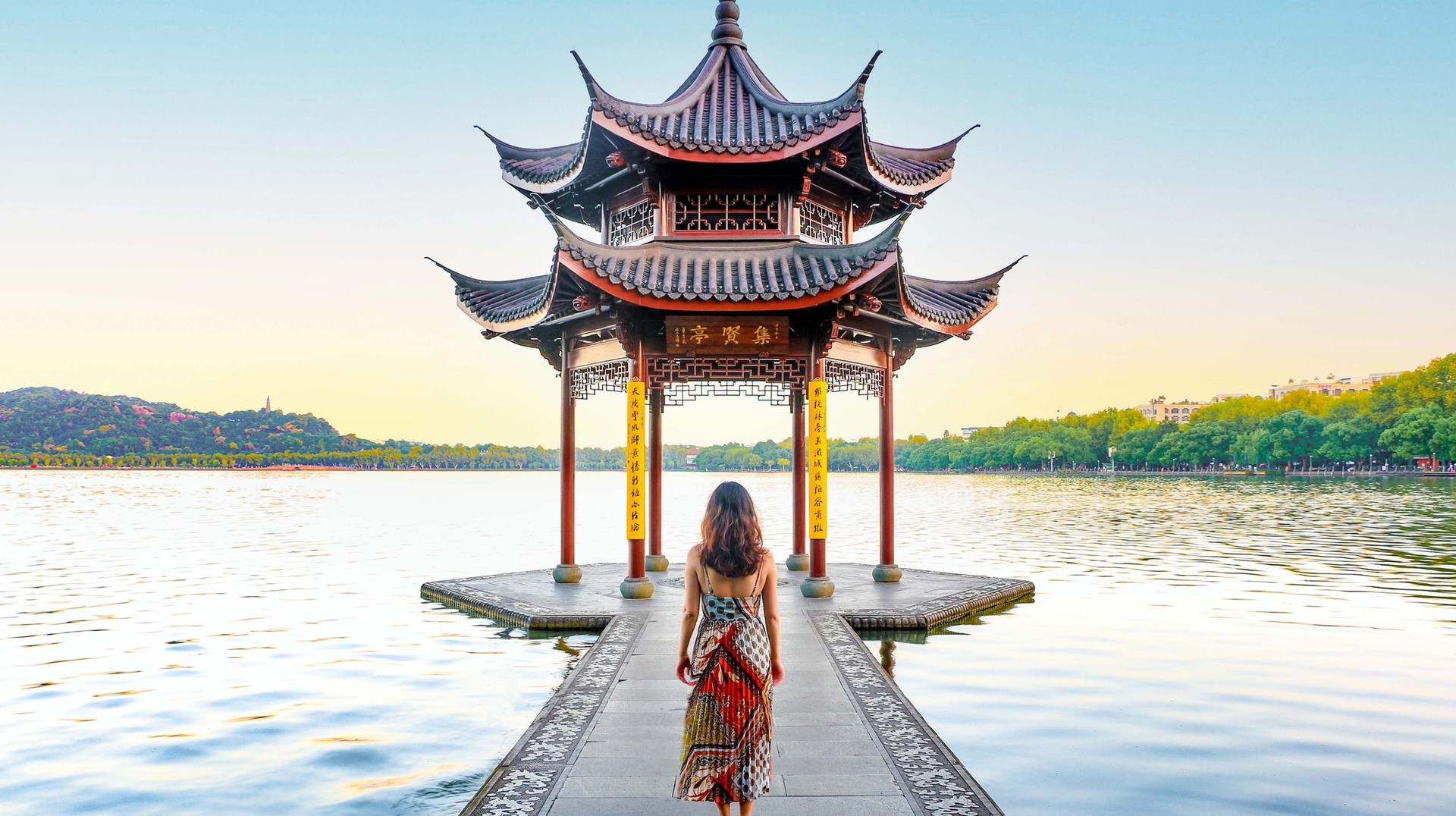 The low prices and fewer crowds make touring China in January a pleasure. A woman at the Jixian Pavilion during a trip to China in January.