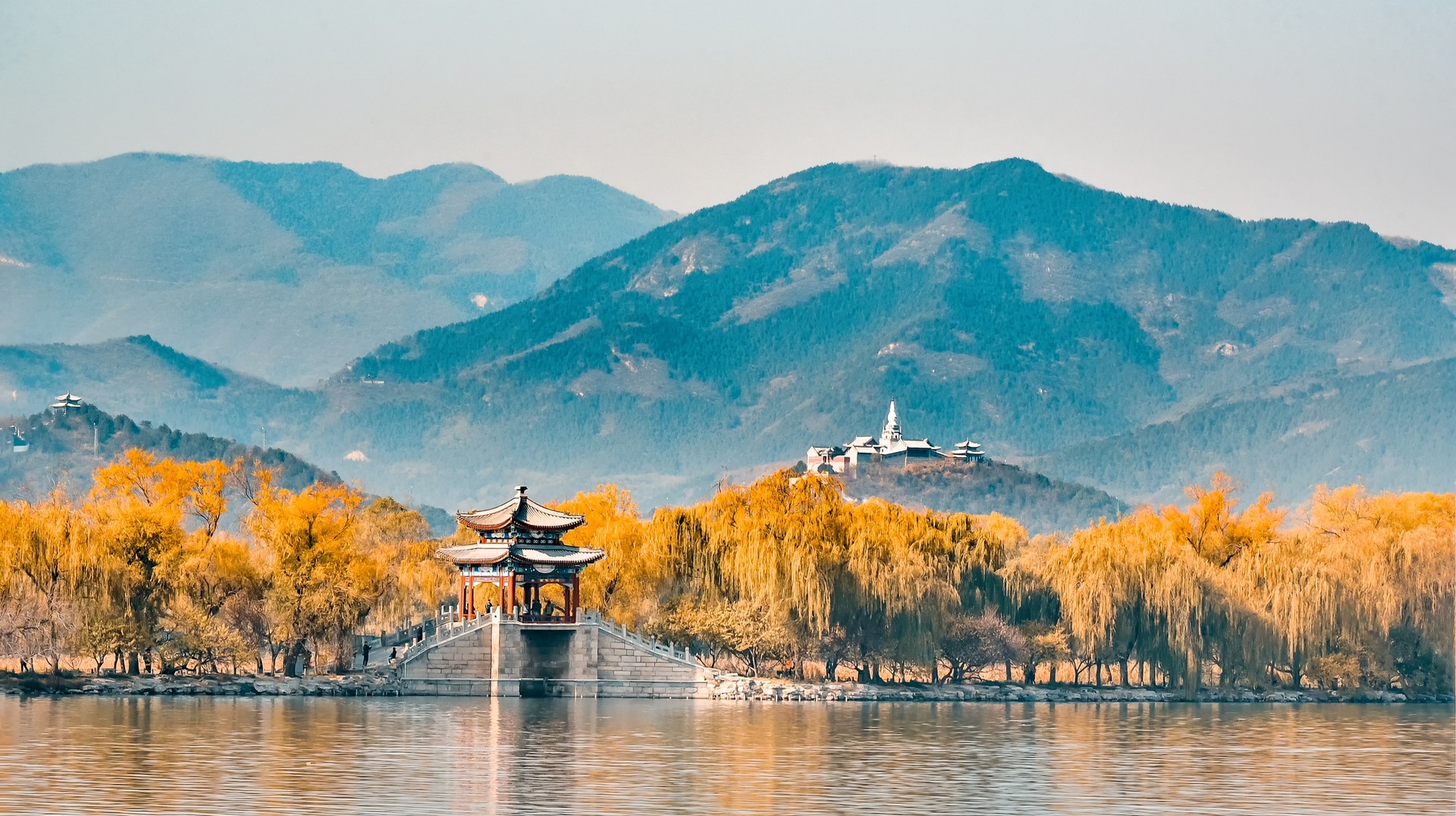 You are bound to have amazing vacation photos during your trip to China in fall. Summer Palace surrounded by autumn foliage in China in October.