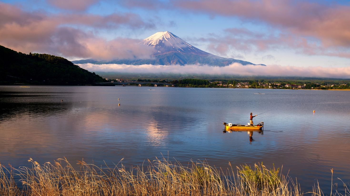 When you're climbing Mount Fuji, don't miss out on the picturesque Lake Kawaguchi that offers the best view of Mount Fuji.