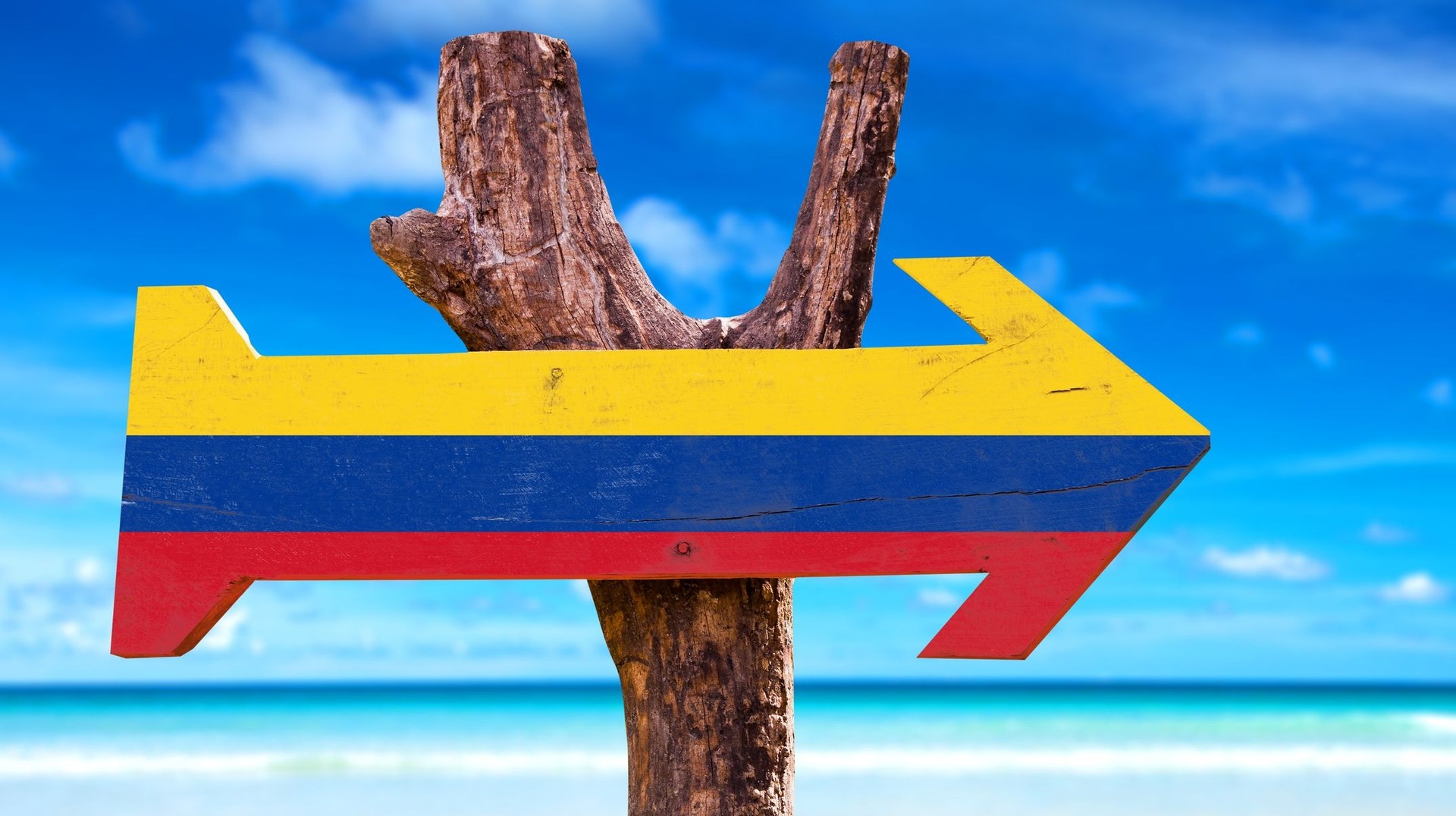 2 weeks is enough to not just tour Colombia but its neighboring countries as well. Find Colombian flags painted on road signs during two weeks in Colombia.