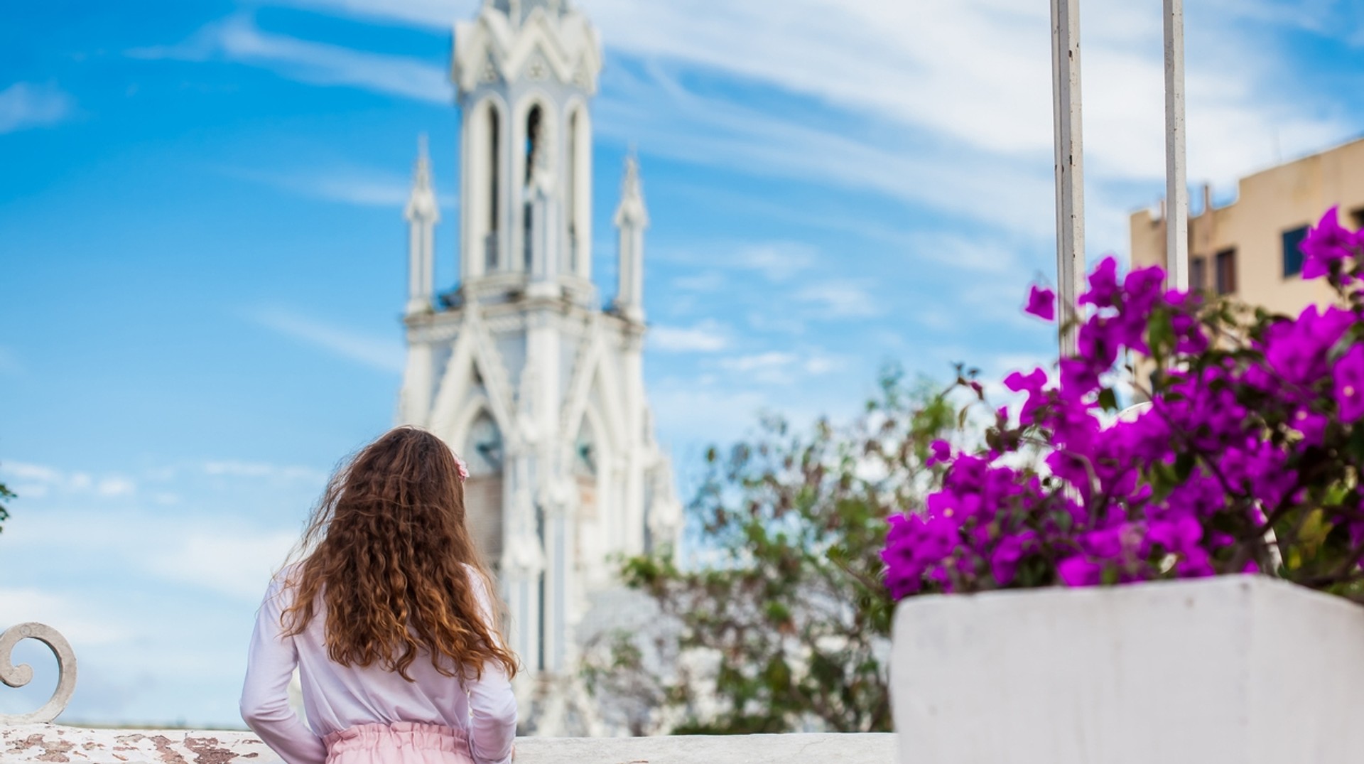 Take in the architectural marvels like the famous Gothic church of the La Ermita in Cali, Colombia. View of La Ermita from the Ortiz Bridge, Colombia in December