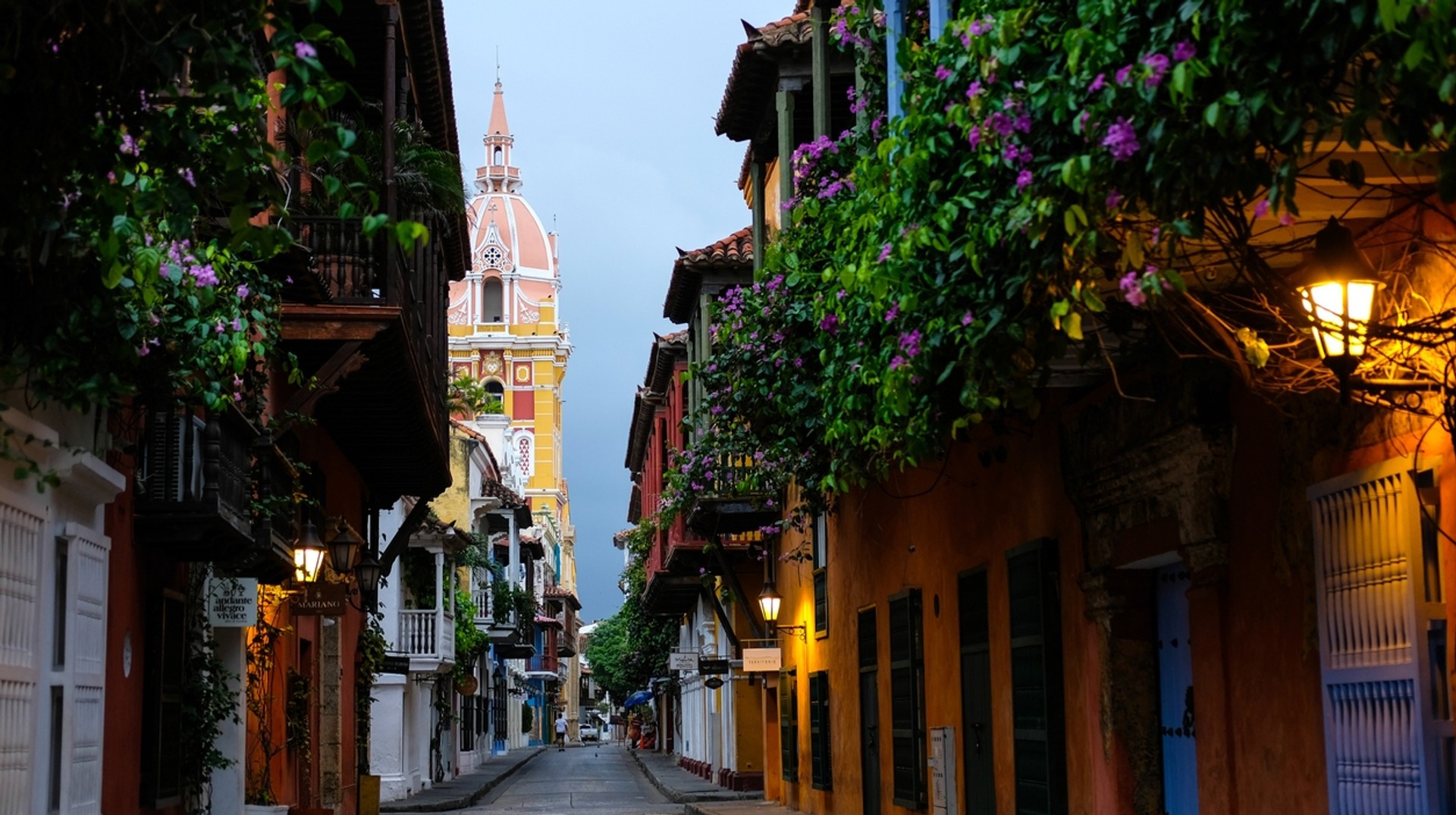The iconic Cathedral Basilica of Saint Catherine of Alexandria tower stands at the end of the road in Cartagena. Cathedral Tower at the end of the road in Cartagena, Colombia in June