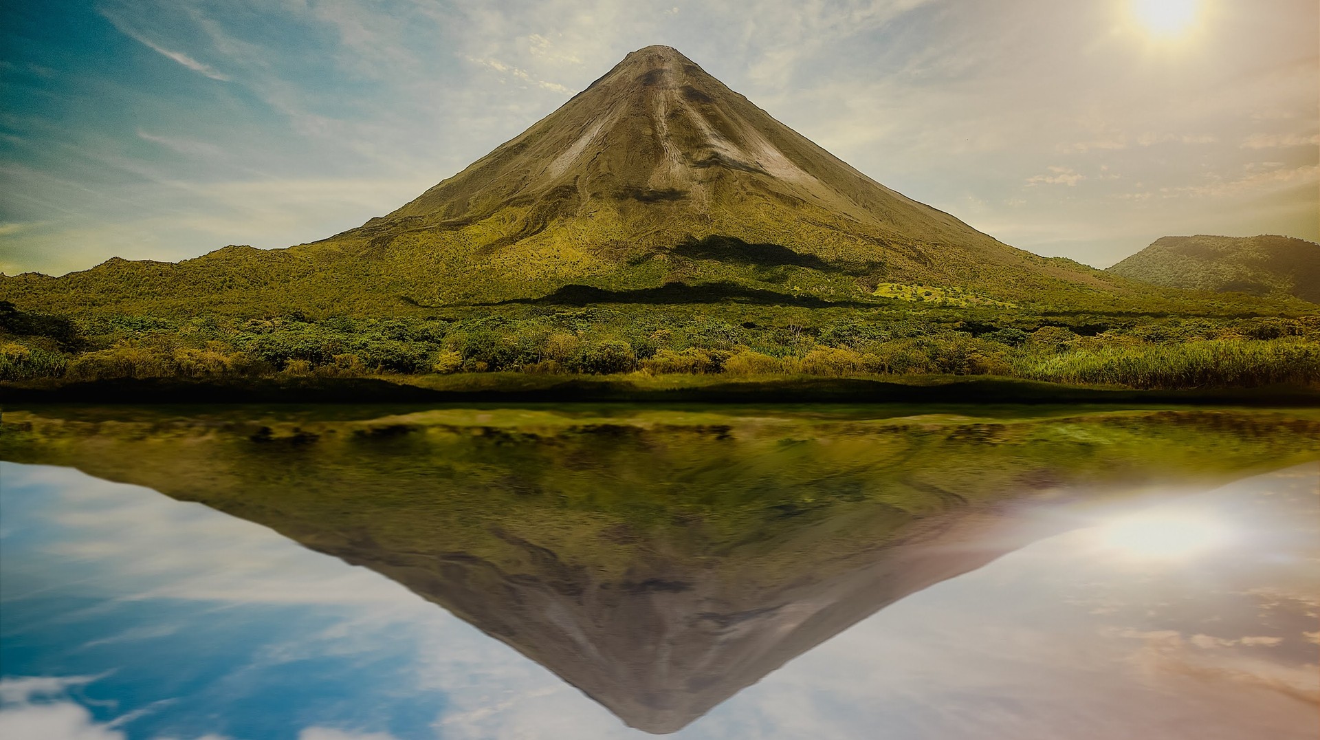 Arenal Volcano is a must-visit site when spending 8 days in Costa Rica. Arenal Volcano during dawn; one of the best places to visit when spending 8 days in Costa Rica.