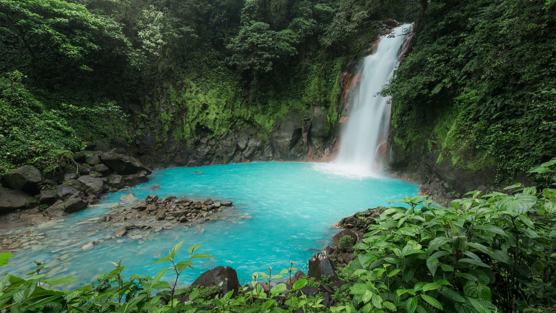 The view of a tropical waterfall of Rio Celeste in Costa Rica