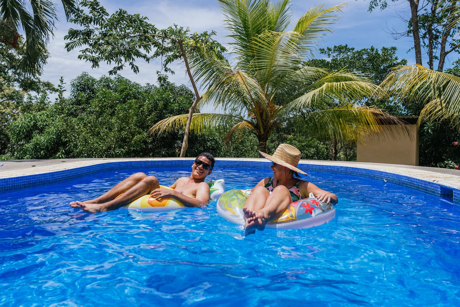 A couple relaxing in a pool in Costa Rica
