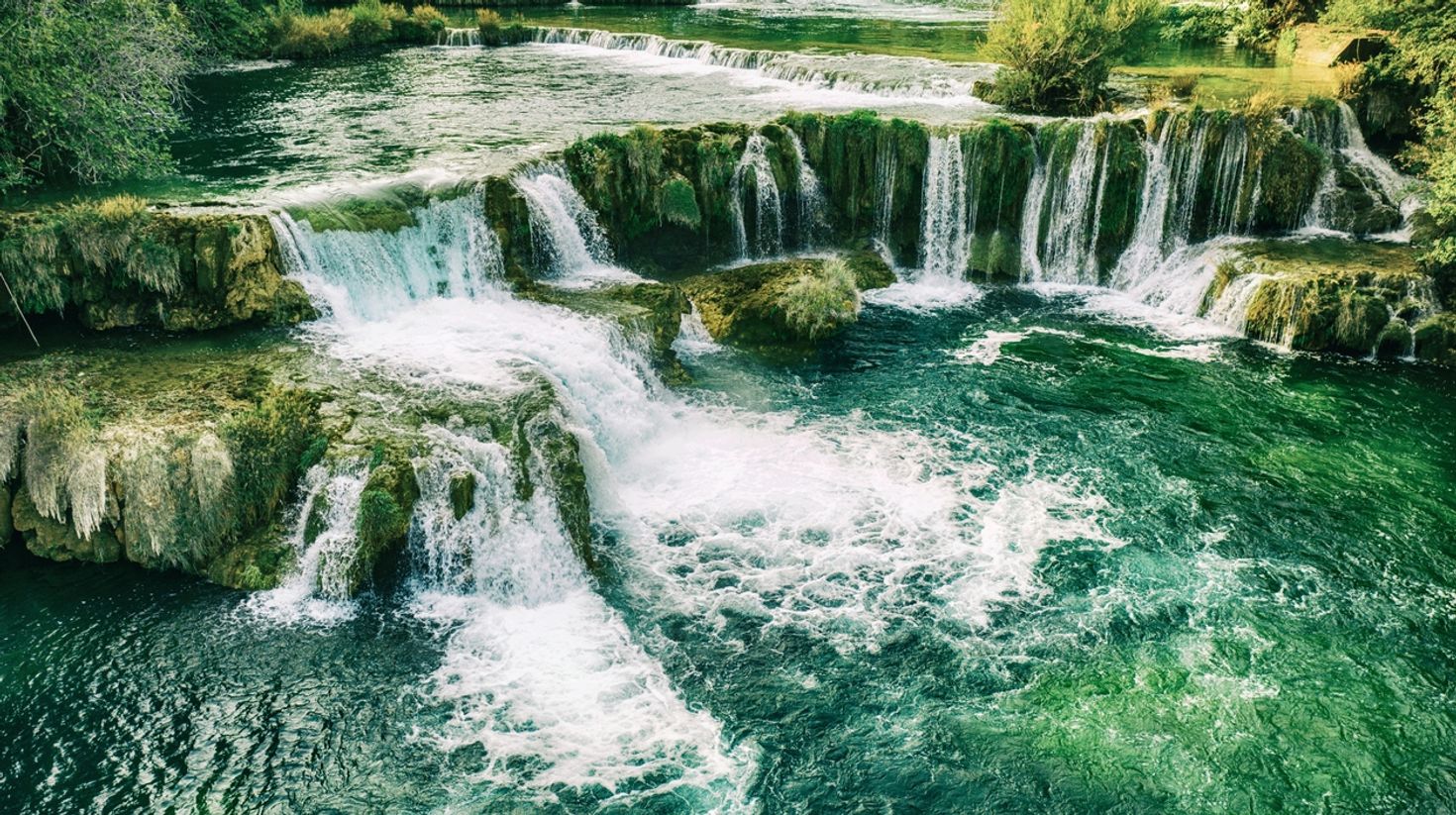 Enjoy the waterfalls at Krka in Croatia in October.