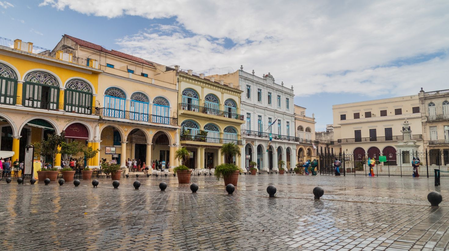 Old colonial buildings on Plaza Vieja after rainfall in Cuba in August