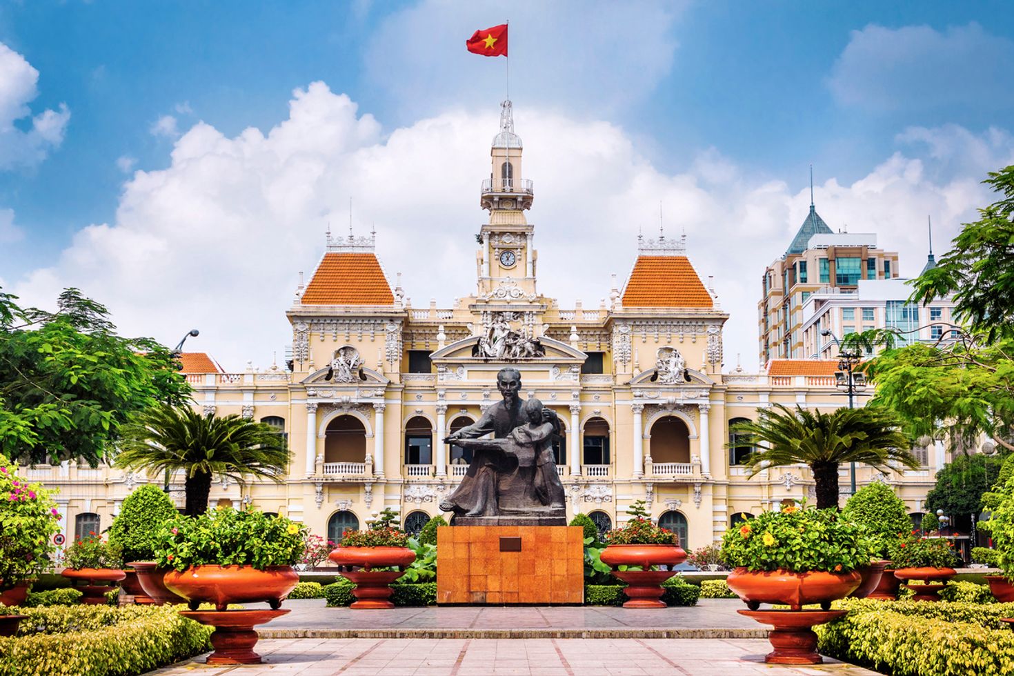 The statue of Ho Chi Minh with People's Committee Building at the back.