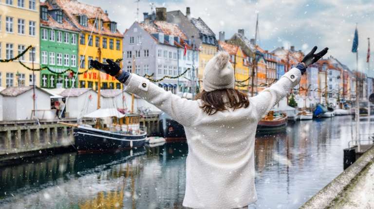 Woman enjoying in Copenhagen on her trip to Denmark in January.