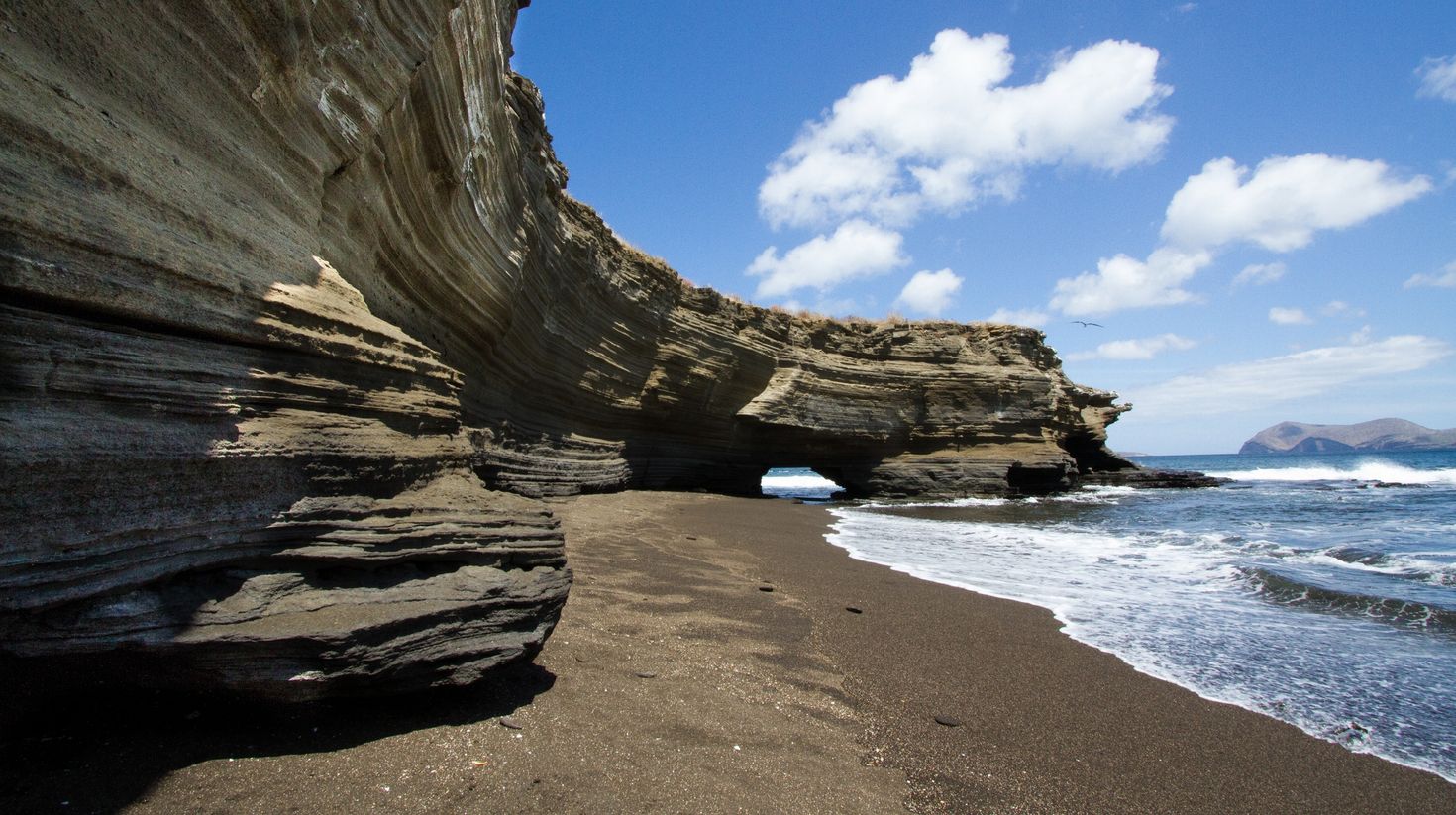 Visit coastal sandstone cliffs during good weather in Galapagos Islands.