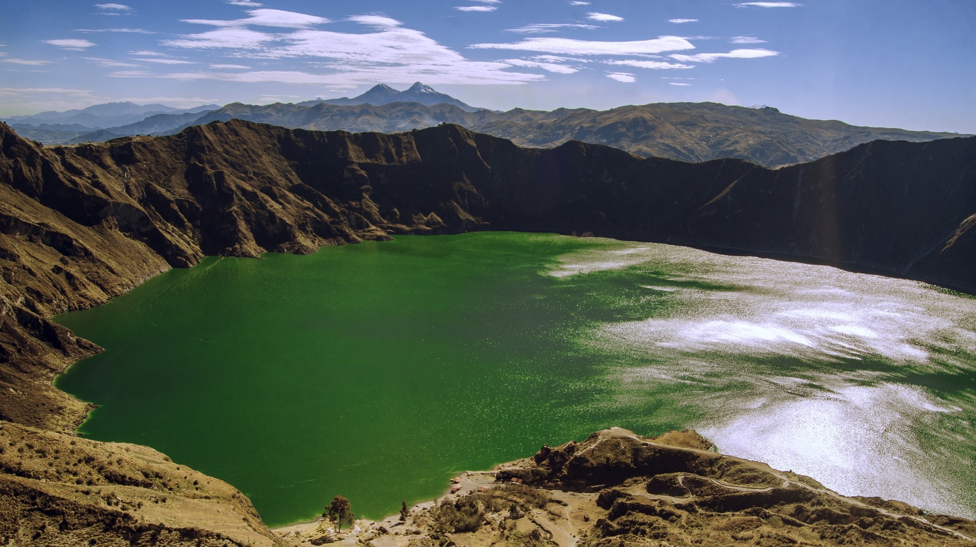 Quilotoa lake and the Andes look amazing during sunny weather in Ecuador.