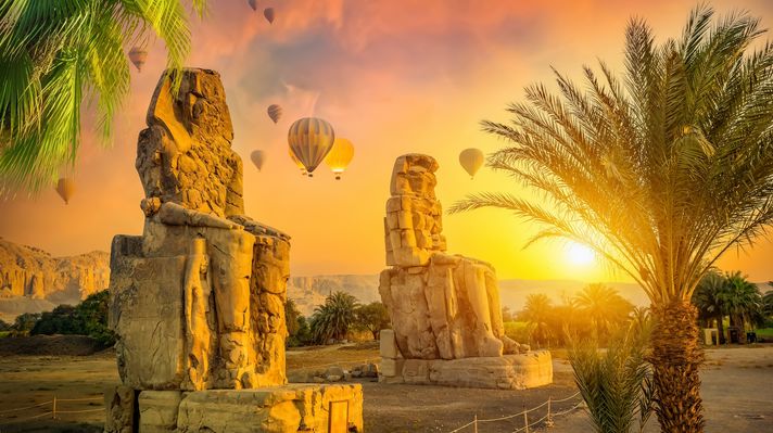 View the Colossi of Memnon from a hot air balloon ride.